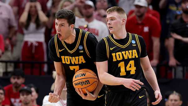 HOUSTON, TEXAS - MARCH 26: Alvaro Folgueiras #7 of the Iowa Hawkeyes celebrates a basket with Bennett Stirtz #14 against the Nebraska Cornhuskers during the second half in the Sweet Sixteen of the 2026 NCAA Men's Basketball Tournament at Toyota Center on March 26, 2026 in Houston, Texas. (Photo by Alex Slitz/Getty Images)