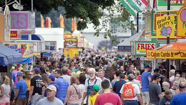 UNITED STATES - AUGUST 09: Guests walk though the 2014 Iowa State Fair in Des Moines, Iowa, August 9, 2014. (Photo By Tom Williams/CQ Roll Call)