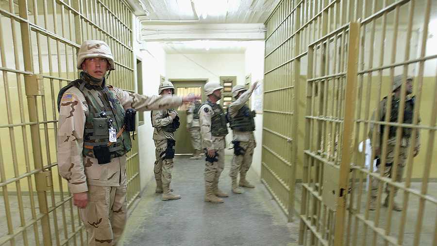 U.S. soldiers maintain security at the Abu Ghraib prison May 10, 2004 in Abu Ghraib, Iraq.