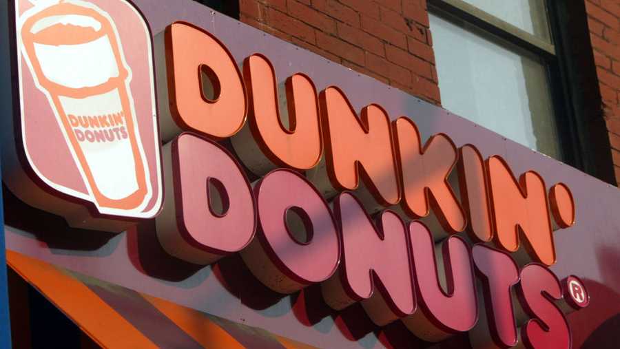 NEW YORK - MAY 13:  A Dunkin Donuts sign is seen May 13, 2004 in New York City. Dunkin Donuts plans to open 10 stores inside Wal-Mart stores within the next three months. (Photo by Mario Tama/Getty Images)