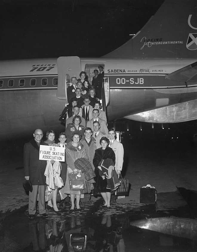 The 18 members of the U.S. figure skating team are shown as they boarded the ill-fated Belgian airliner here, February 4th, for a flight to Brussels. The skaters were heading for Prague to compete in the world championships. Instead, they all met death when the plane crashed while trying to land in Brussels, February 15th. All 73 people aboard the plane died. At left is team manager Dean McMinn. Alongside him is 16-year-old Laurence Owen, of Winchester, MA, known as &quot;America&apos;s Queen of the Ice.&quot;