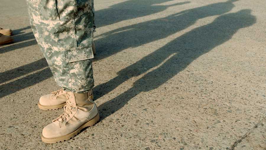 File Photo: A soldier wears combat boots, included in the Army Combat Uniform.