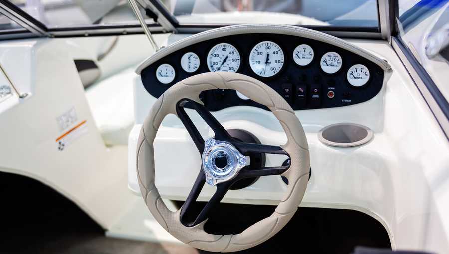close up of small white speedboat at nautical exhibition