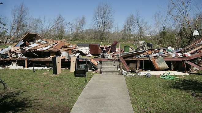 BRADFORD, TN - APRIL 4:   Possessions lay piled up on the floor of a trailer home after it was destroyed by a tornado April 4, 2006 in Bradford, Tennessee. At least 23 people in Tennessee, including a family of four in Bradford, were killed as tornados cut a path across the state on April 2, 2006.  (Photo by Scott Olson/Getty Images)