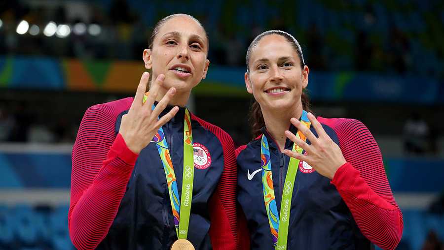 RIO DE JANEIRO, BRAZIL - AUGUST 20:  (L-R) Gold medalists Diana Taurasi #12 and Sue Bird #6 of United States celebrate during the medal ceremony after the Women&apos;s Basketball competition on Day 15 of the Rio 2016 Olympic Games at Carioca Arena 1 on August 20, 2016 in Rio de Janeiro, Brazil.  (Photo by Tom Pennington/Getty Images)