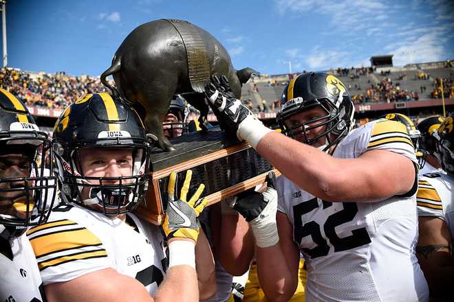 MINNEAPOLIS,&#x20;MN&#x20;-&#x20;OCTOBER&#x20;8&#x3A;&#x20;Iowa&#x20;celebrate&#x20;a&#x20;win&#x20;of&#x20;the&#x20;game&#x20;against&#x20;Minnesota&#x20;with&#x20;Floyd&#x20;of&#x20;Rosedale&#x20;Trophy&#x20;on&#x20;October&#x20;8,&#x20;2016&#x20;at&#x20;TCF&#x20;Bank&#x20;Stadium&#x20;in&#x20;Minneapolis,&#x20;Minnesota.&#x20;Iowa&#x20;defeated&#x20;Minnesota&#x20;14-7.&#x20;&#x28;Photo&#x20;by&#x20;Hannah&#x20;Foslien&#x2F;Getty&#x20;Images&#x29;