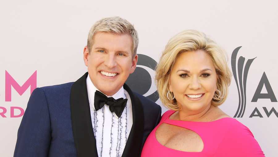 LAS VEGAS, NV - APRIL 02:  Todd Chrisley and Julie Chrisley arrive at the 52nd Academy of Country Music Awards held at T-Mobile Arena on April 2, 2017 in Las Vegas, Nevada.  (Photo by Michael Tran/FilmMagic)
