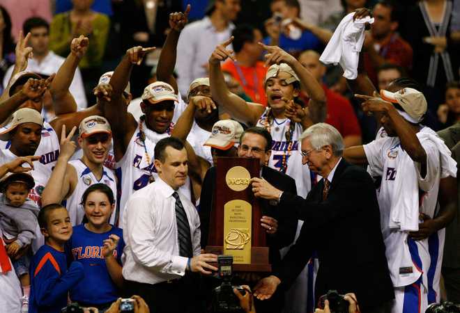 ATLANTA - APRIL 02:  Head coach Billy Donovan and his Florida Gators celebrate with the trophy after defeating the Ohio State Buckeyes during the NCAA Men&amp;apos;s Basketball Championship game at the Georgia Dome on April 2, 2007 in Atlanta, Georgia.  (Photo by Win McNamee/Getty Images)
