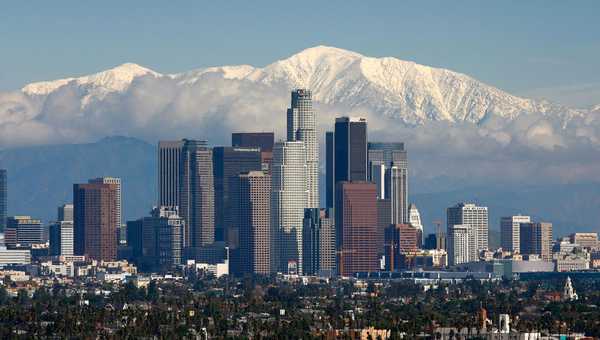 Fresh snow blankets the mountains behind the downtown skyline after a series of storms that hammered northern California delivered much needed precipitation to the Greater Los Angeles Area January 7, 2008 in Los Angeles, California. With the threat of mandatory water rationing still in effect because of prolonged drought, the rain is a small step toward relief. Forecasters had predicted flash floods and mudslides near large areas that were denuded by wildfires of historic proportions in October, and some mandatory evacuations were declared, but little damage was reported.