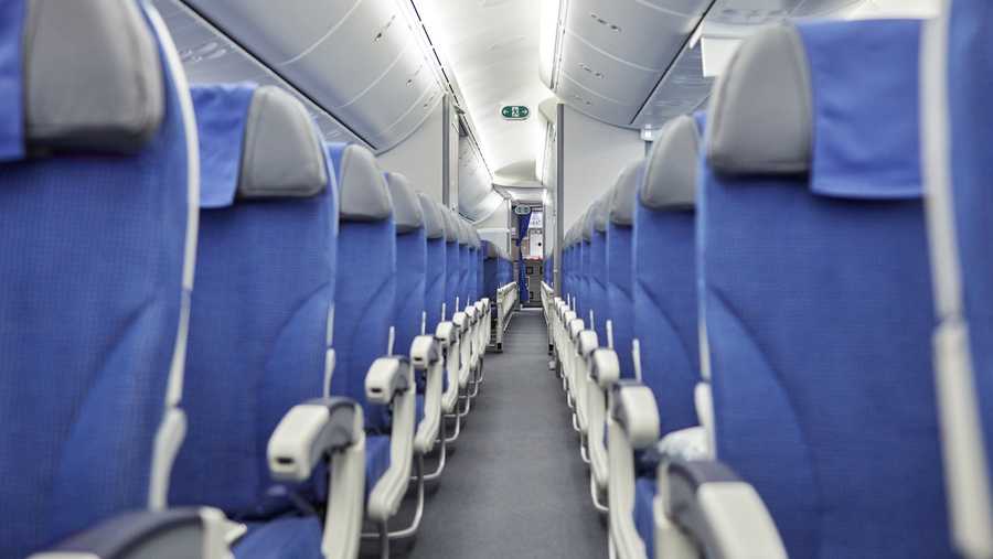 Empty blue seats in a row in airplane