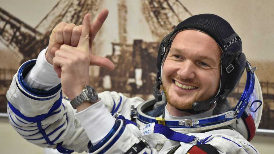 Member of the International Space Station (ISS) expedition 56/57, German astronaut Alexander Gerst gestures as his space suit is tested in the Russian-leased Baikonur cosmodrome on June 6, 2018.