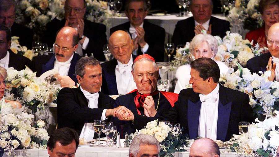Republican presidential candidate George W. Bush shakes hands with Vice President and Democratic presidential candidate Al Gore during the Alfred E. Smith Memorial Dinner.