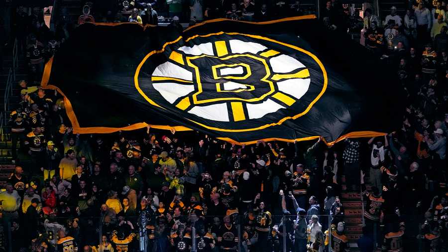 Bruins walk through the crowds to get to the TD Garden