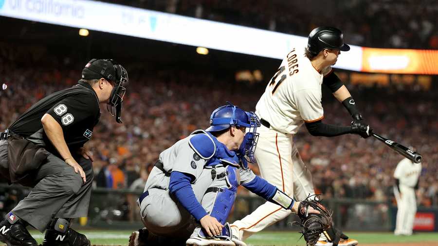 SAN FRANCISCO, CALIFORNIA - OCTOBER 14: Wilmer Flores #41 of the San Francisco Giants strikes out on a checked swing for the final out of the game against the Los Angeles Dodgers during the ninth inning in game 5 of the National League Division Series at Oracle Park on October 14, 2021 in San Francisco, California. The Los Angeles Dodgers beat the San Francisco Giants 2-1. (Photo by Harry How/Getty Images)