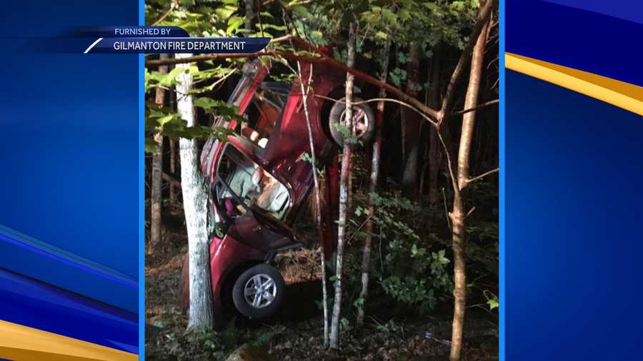 Car ends up vertical against tree following crash in Gilmanton