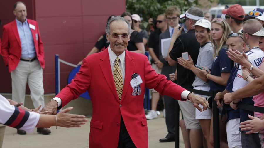 Former New England Patriot Gino Cappelletti outside the Patriot's Hall of Fame prior to an NFL football training camp in Foxborough, Mass., Wednesday, Aug. 5, 2015. (AP Photo/Charles Krupa)