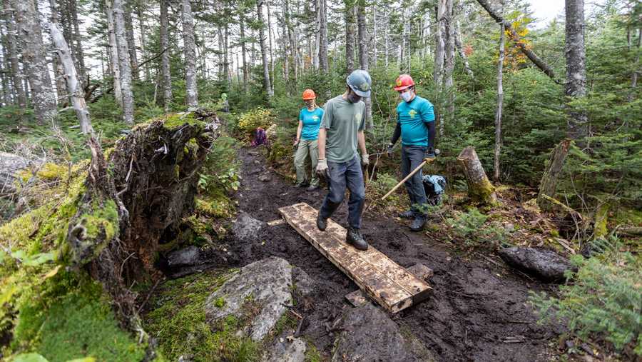 FILE -- Workers with the Green Mountain Club complete trail maintenance in June, 2021.