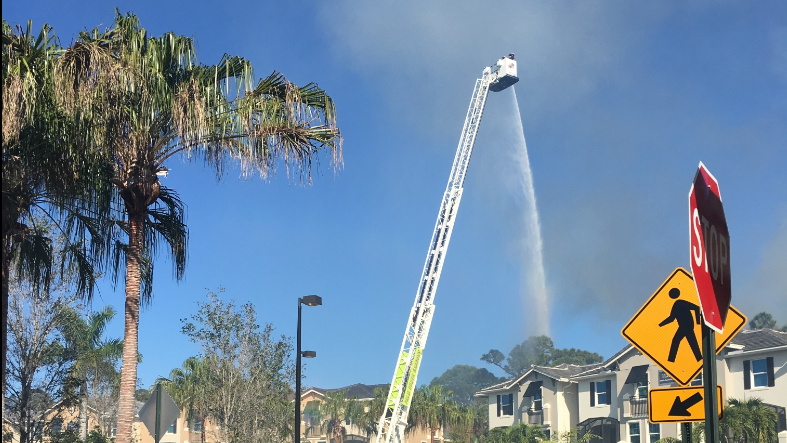 Crews battle brush fire in Palm Beach Gardens