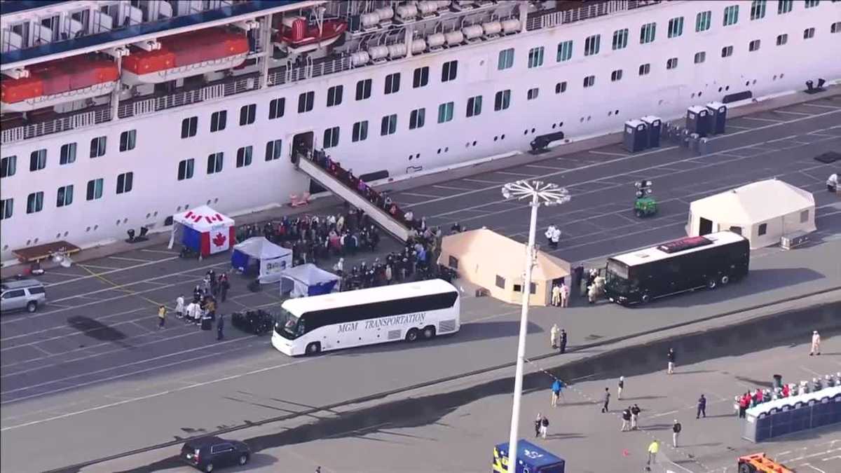 Some passengers disembark cruise ship after docking in Oakland