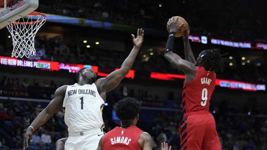 new orleans pelicans forward zion williamson (1) reaches for a rebound held by portland trail blazers forward jerami grant (9) during the first half of an nba basketball game in new orleans, thursday, nov. 10, 2022. (ap photo/gerald herbert)