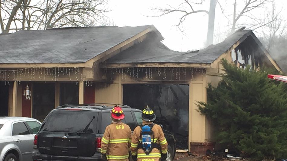 Crews battle house fire in Greenwood