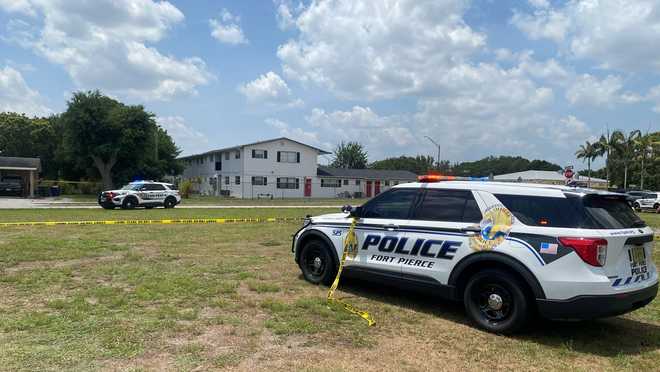 Fort Pierce Police cruiser and Sheriff's Office cruiser at the scene.