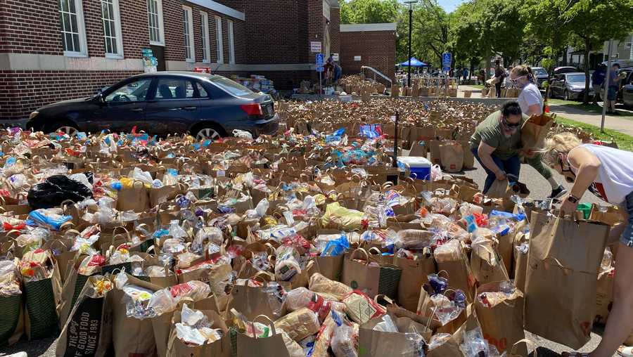 Donated groceries fill the parking lot of Sanford Middle School in Minneapolis.