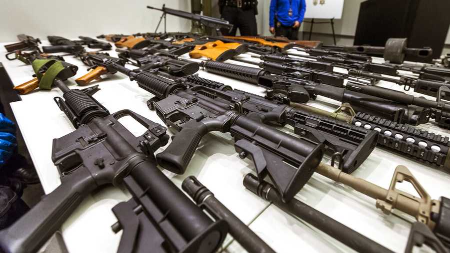 FILE - In this Dec. 27, 2012, file photo, a variety of military-style semi-automatic rifles obtained during a buy back program are displayed at Los Angeles police headquarters. The 9th U.S. Circuit Court of Appeals overturned two lower court judges and upheld California’s ban on high-capacity magazines Tuesday, Nov. 30, 2021, in a split decision that may be headed for the U.S. Supreme Court.  (AP Photo/Damian Dovarganes, File)