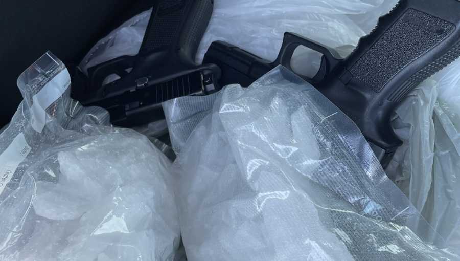 two handguns, two pounds of crystal methamphetamine and a small amount of cannabis.