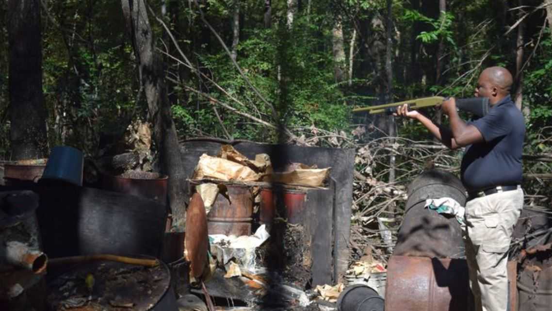 Guns, axes used to destroy illegal moonshine operation in Orangeburg