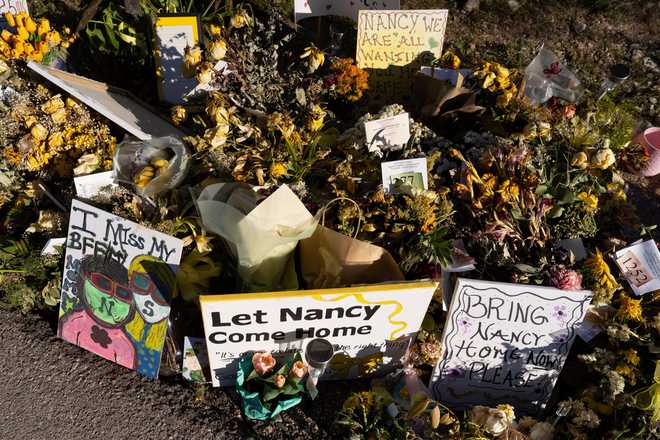 FILE - An ever-growing collection of yellow flowers and notes sit at the home of Nancy Guthrie, the missing mother of &amp;quot;Today&amp;quot; show host Savannah Guthrie, on March 6, 2026.