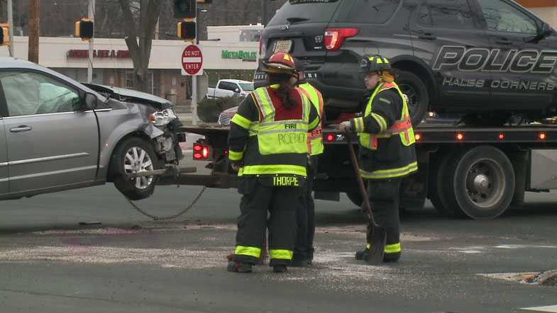 Police: Driver goes through red light, hits squad car