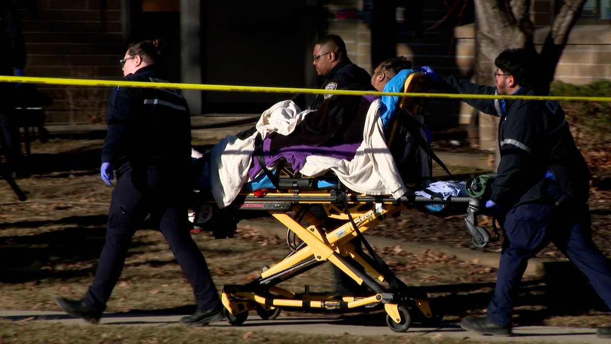 Firefighters rush to rescue people from burning apartment complex