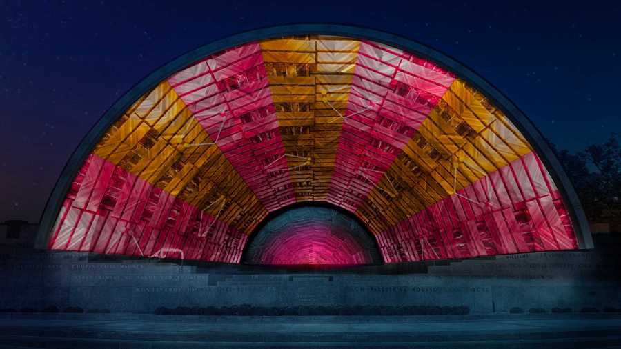 Colorful lights are projected onto the Hatch Shell for “Hatched: Breaking through the Silence"