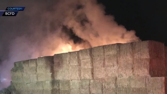 Dairy farm takes big hit after hay fire