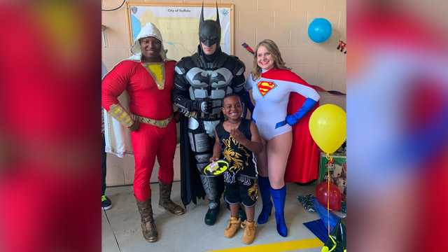 Erick Hill with super heroes