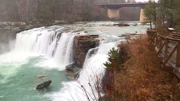 Water falling over the edge of a rocky waterfall