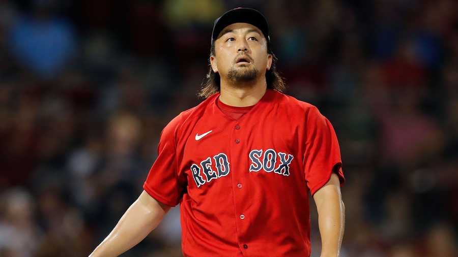 Boston Red Sox's Hirokazu Sawamura walks to the dug out after pitching during the fourth inning of a baseball game against the Texas Rangers, Saturday, Aug. 21, 2021, in Boston. (AP Photo)