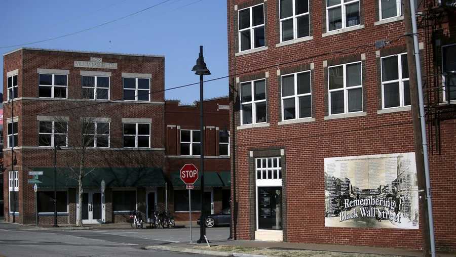 In this Feb. 12, 2019 file photo, historic buildings on Greenwood, the Historic Black Wall Street, house new businesses in Tulsa, Oklahoma. A $500,000 grant announced Tuesday, April 8, 2020, from the National Park Service will be used to renovate buildings along Tulsa's former Black Wall Street. It comes nearly 100 years after the area was largely destroyed and as many as 300 people were killed in one of the nation's deadliest outbreaks of racial violence. (John Clanton/Tulsa World via AP File)