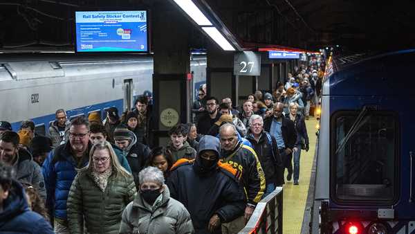 Travelers walk along the platform as they arrive at Grand Central Station in New York, on Thursday, Dec. 21, 2023.