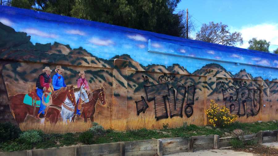 Colorful Hollister mural vandalized with black spray paint