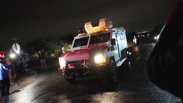 Pima County Sheriff blocks a road near Nancy Guthrie's home in Tucson, Ariz. on Friday, Feb. 13, 2026.