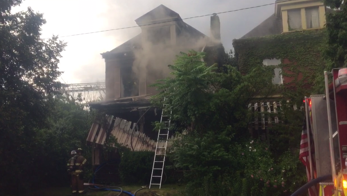 Woman jumps from window, man catches her in Homewood North fire