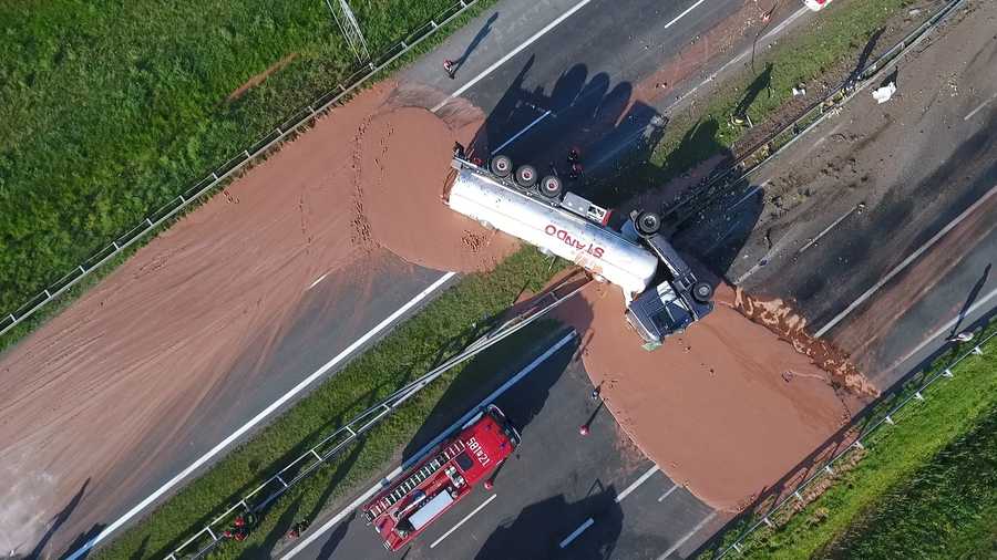 Hot chocolate poured on to the A2 highway between Wrzesnia and Slupca near Poznan in western Poland, after a the truck transporting the sweet freight crashed through a traffic barrier on May 9, 2018. 