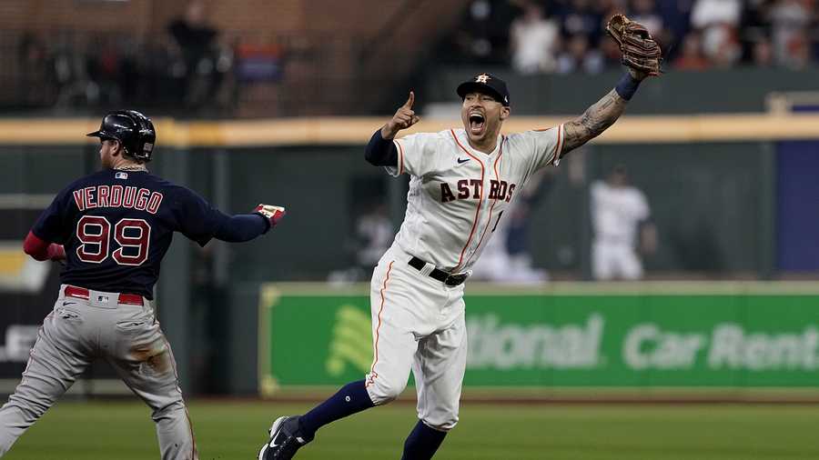 Houston Astros shortstop Carlos Correa celebrates after tagging out Boston Red Sox's Alex Verdugo at second to end the top of the seventh inning in Game 6 of baseball's American League Championship Series Friday, Oct. 22, 2021, in Houston.
