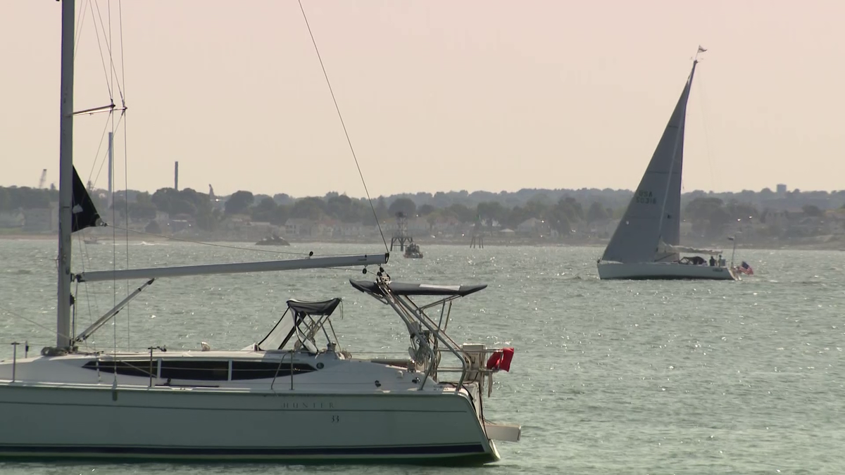 Person pulled from water after boat capsizes off Massachusetts beach dies, state police say