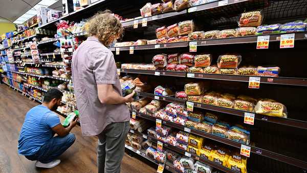 People shop for bread at a supermarket in Monterey Park, California on October 19, 2022. (Photo by FREDERIC J. BROWN/AFP via Getty Images)