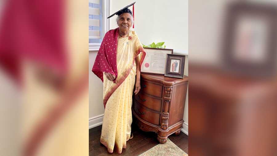 Varatha Shanmuganathan smiles after earning her master's degree in political science from York University.
