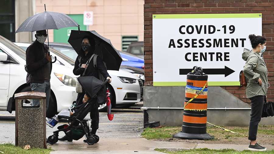 People line up to be tested for COVID-19 at a testing centre in Toronto on Sunday, Sept. 13, 2020.