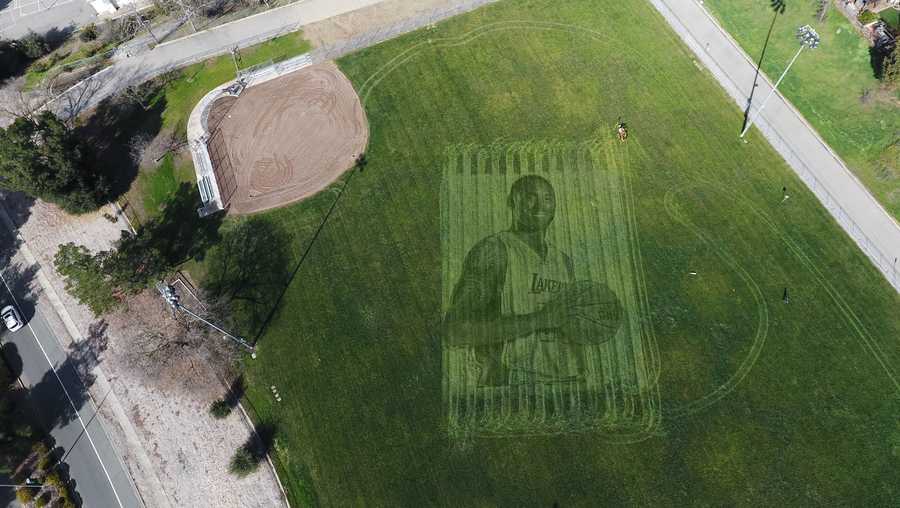 Kelli Pearson and her husband, Pete Davis, created a 115-foot tall mural of Kobe Bryant in a grass field in California.